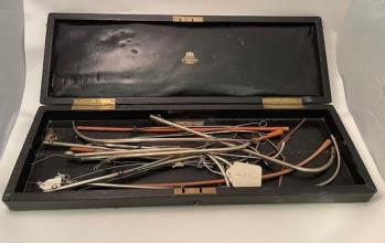 Bougies, silver catheters, gum elastic rubber, in case.